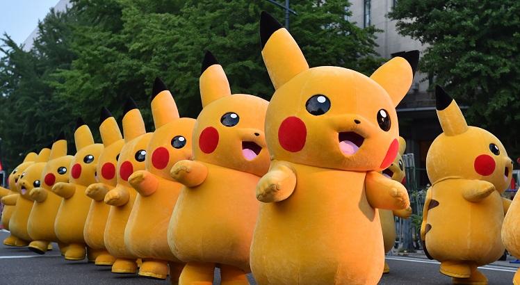 (FILES) This file picture taken on August 2, 2015 shows costumed performers dressed as Pikachu, the popular animation Pokemon series character, attending a promotional event at the Yokohama Dance Parade in Yokohama.
 Nintendo shot past Sony in market value on July 19, 2016 after the videogame giant's stock more than doubled since the release of the wildly popular Pokemon Go game.  - 
 / AFP / KAZUHIRO NOGI